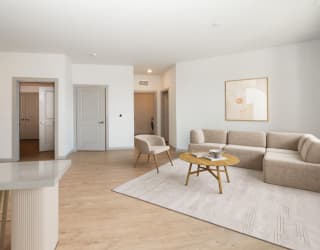 a living room with a couch and a table at The Waterford At Rocketts Landing Apartments, PRG Real Estate, Richmond, Virginia