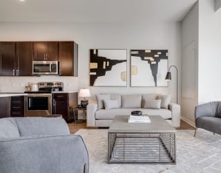 Living space with warm brown floors in luxury apartment Woodbury MN 55125