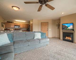 a living room with a couch and a fireplace