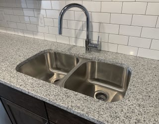 Stainless steel undermount sink with a chrome faucet