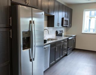 Kitchen with natural lighting and matching stainless steel appliances