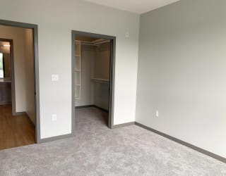 Bed room with large walk in closet with shelving