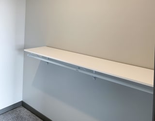 Walk-in closet with shelving and rods in the Serenity floorplan at Haven at Uptown