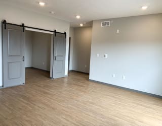 Large open living dining area with den