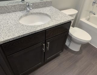 Bathroom vanity with one sink and cabinet storage
