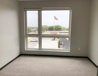 Bedroom with large window with view outside to north Lincoln, Nebraska