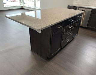 Kitchen island with room for seating and storage space inside