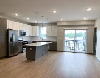 Living and dining area off of the kitchen at haven at uptown in lincoln nebraska