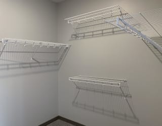 walk in closet with hanging and storage space at haven at uptown
