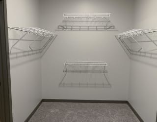 Walk in closet with hanging and shelving space at haven at uptown