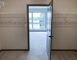 View from the walk in closet to the bedroom at haven at uptown