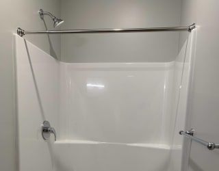 Built in walk in shower in studio bathroom at Haven at Uptown