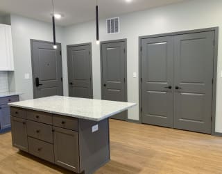 Luxury kitchen with matching stainless steel appliances and large granite counters at Haven at Uptown in Lincoln, Nebraska