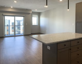 View of the living area from the kitchen at Haven at Uptown
