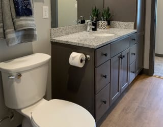 Large vanity and linen storage in the Bliss floor plan in Slate finish at Haven at Uptown in Lincoln.