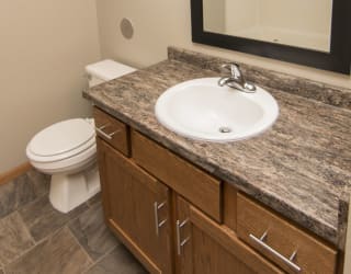 a bathroom with a sink and a toilet