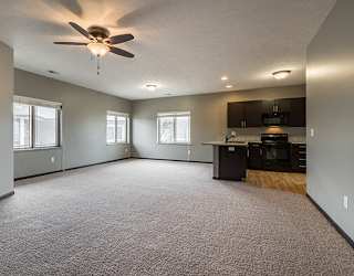 Large living space with kitchen at The Villas of Omaha at Butler Ridge in Omaha Nebraska