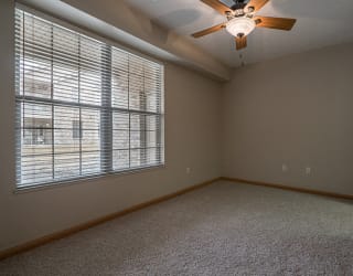 Large bedroom with ceiling fan at Stone Creek Villas Apartments in Omaha Nebraska