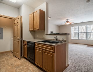 Kitchen with Washer and Dryer in closet at Stone Creek Villas Apartments in Omaha Nebraska