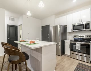 1 bedroom apartment with white cabinets and stainless steel appliances near UNMC in Omaha's Blackstone District