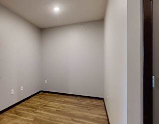 a sleeping area with privacy walls while maintaining an open-concept design