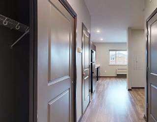 an entryway with closet doors on both sides