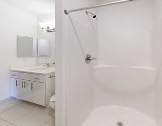 a bathroom with a walk-in shower