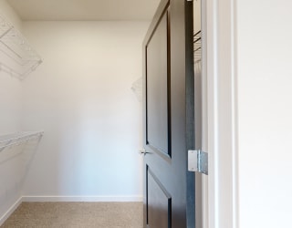 a walk in closet in a 555 waverly unit