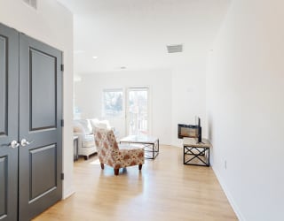 a living room with a couch and a chair