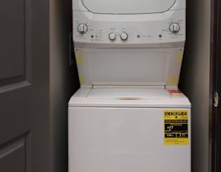 Stacked washer and dryer in a closet