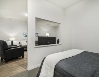 Studio apartment for rent with view of living room at The Conrad in midtown Omaha NE