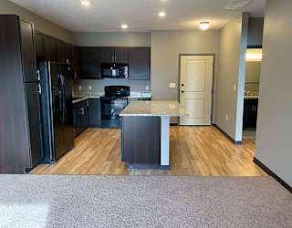 Spacious kitchen with a large island with light granite counter tops  of 1 bedroom apartment for rent at The Flats at 84 best   apartments Lincoln NE 68516