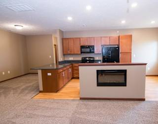 A kitchen with black appliances