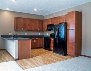 U-shaped kitchen with black appliances