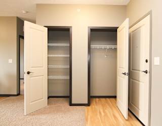 2 closets with open doors