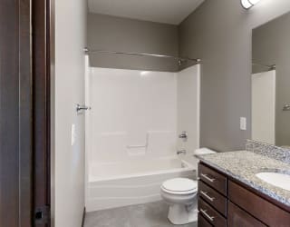 a bathroom with a combination shower and tub
