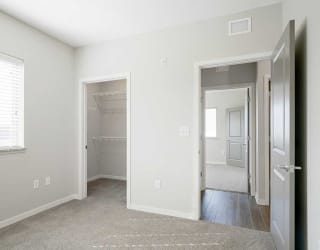 a bedroom with a walk-in closet