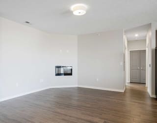 a living room with luxury vinyl wood floors and a fireplace