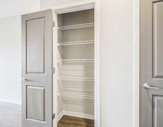 a storage pantry with built-in wire shelves