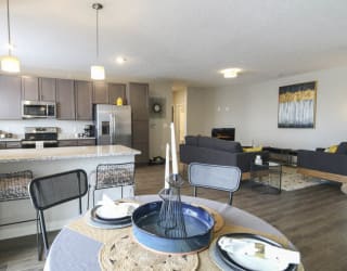 View of kitchen and living room from dining area at WH Flats new luxury apartments in south Lincoln NE 68516