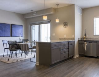 View of dining room from kitchen at WH Flats new luxury apartments in south Lincoln NE 68516