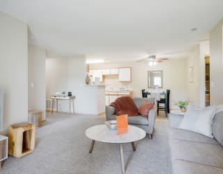 a living room with a couch and a coffee table and a tv