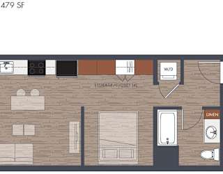 A floor plan of an open bedroom with a laundry area.