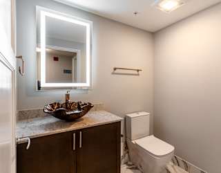 a small bathroom with a mirror and a toilet