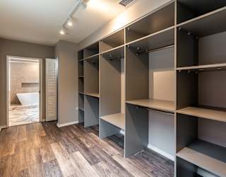 a walk in closet in a new home