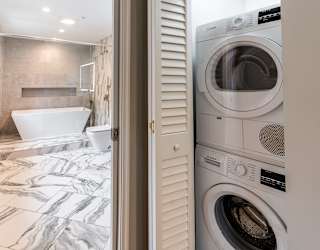 a small laundry room with a washer and dryer