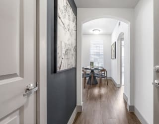 a dining area with a table and chairs in a 555 waverly unit