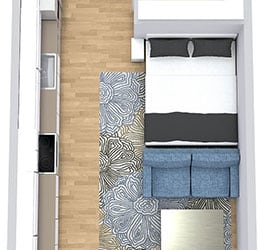 a floor plan of a studio apartment with a kitchen, bed, and bathroom
