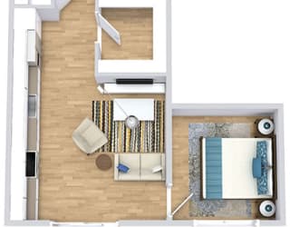 a floor plan with a bed, bathroom, kitchen, and a living area