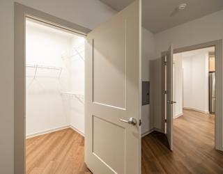 A white door is open to a hallway.